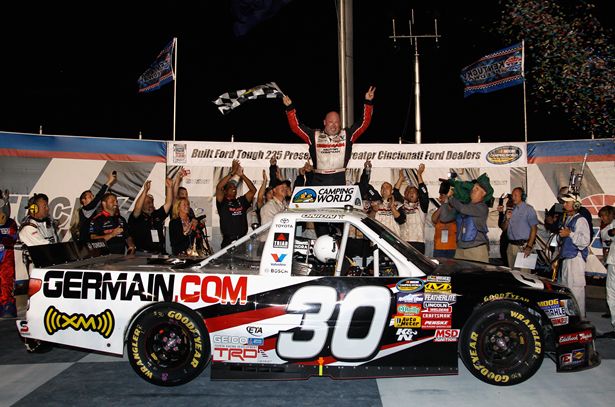 Todd Bodine, driver of the #30 Germain.com Toyota, celebrates after winning the NASCAR Camping World Truck Series Built Ford Tough 225 at Kentucky Speedway. Credit: Chris Graythen/Getty Images for NASCAR
